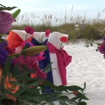 Vase and chairs at Sandbar beach wedding Flowers by Silva dress up Sandbar wedding video